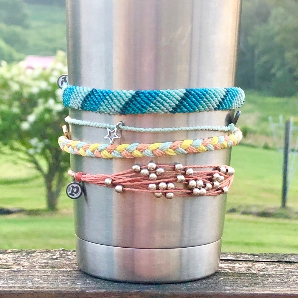 Set of 4 Pura Vida bracelets.